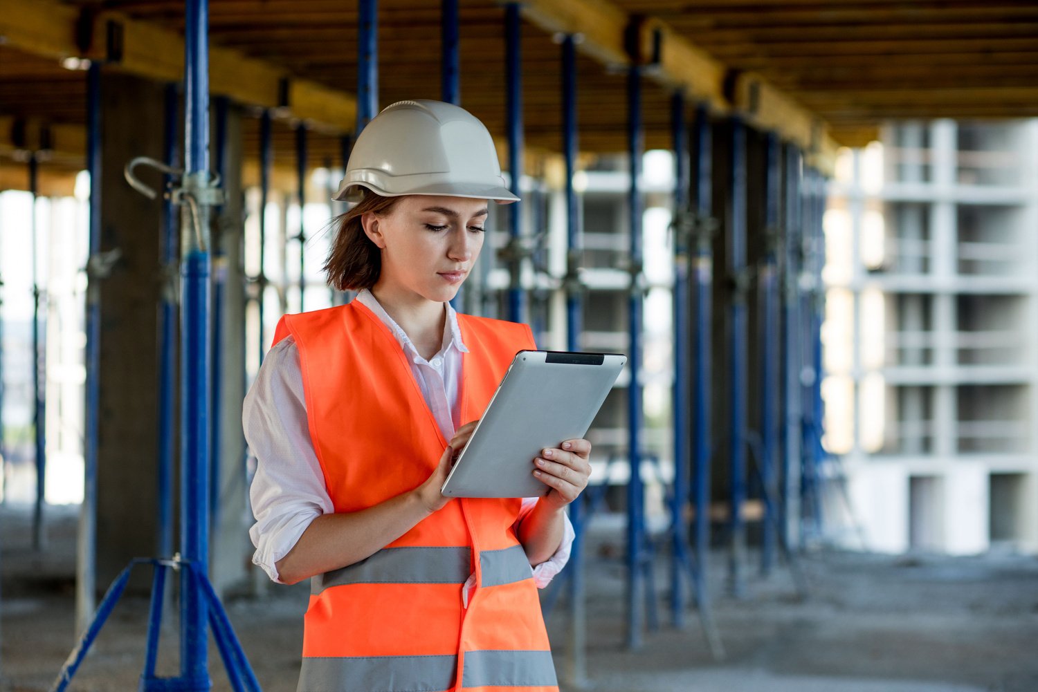 Female construction engineer. Architect with a tablet comput