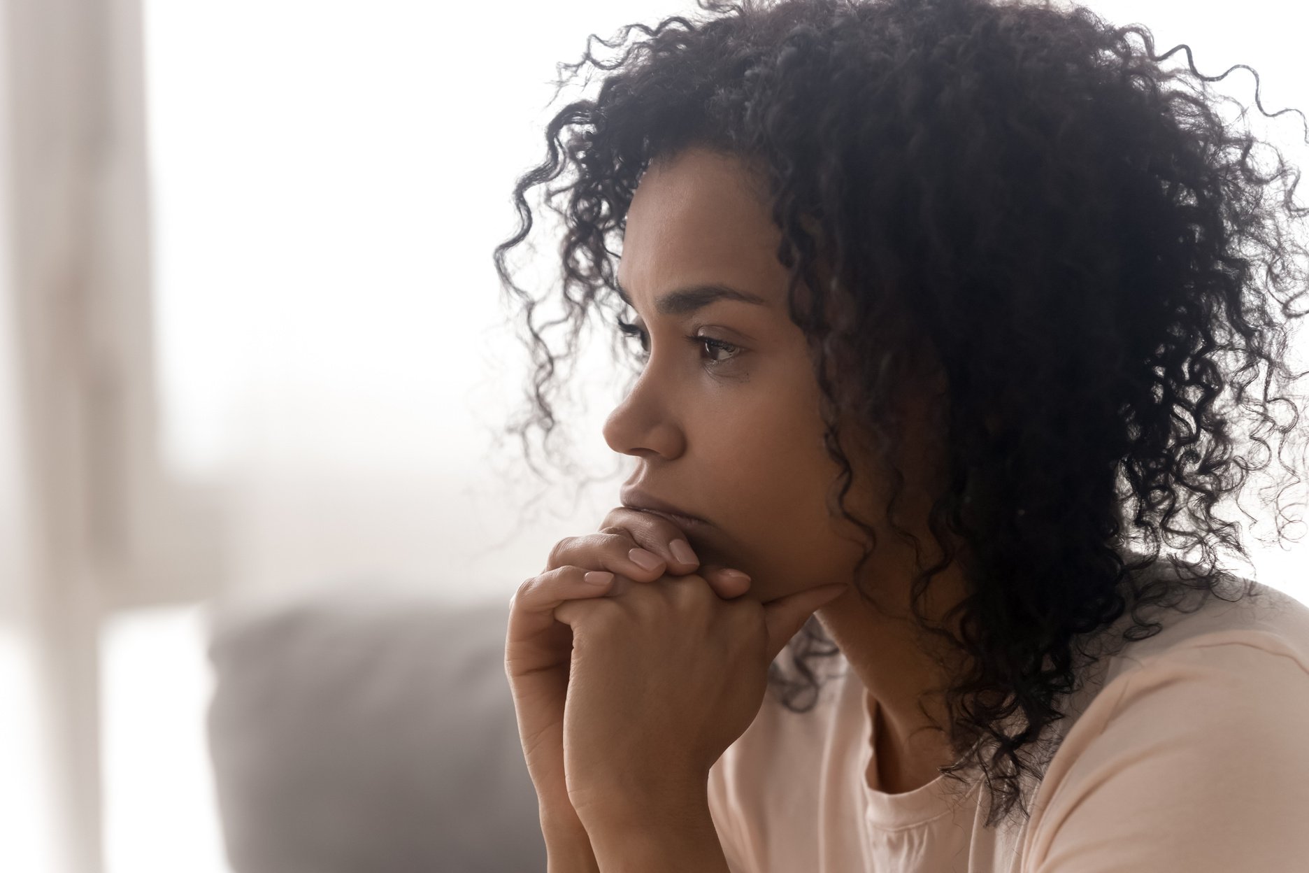 Close up of pensive black woman thinking having life troubles